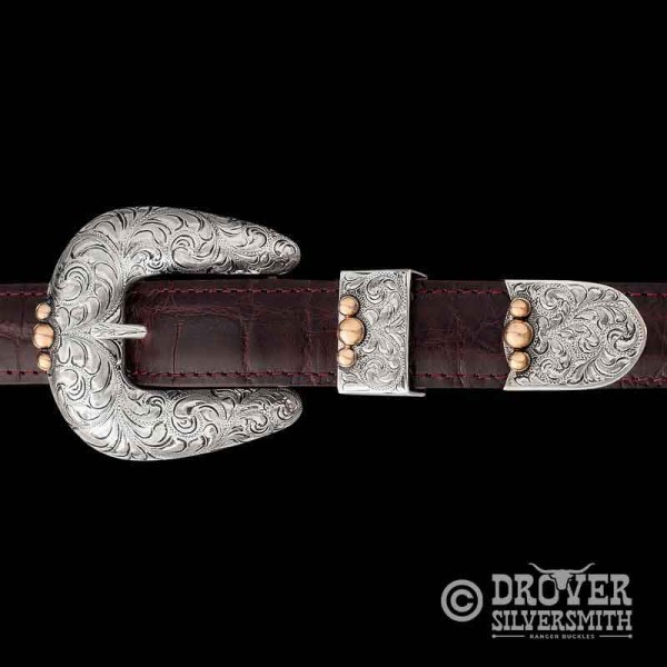 Introducing the Western Heritage Sterling Silver Buckle Set, a classic western look for every ocassion featuring a hand engraved base with jeweler's bronze accents. Add a second loop for a ranger buckle set now!